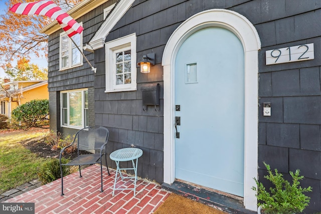 entrance to property with a patio