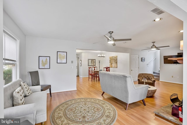 living room with hardwood / wood-style flooring and ceiling fan