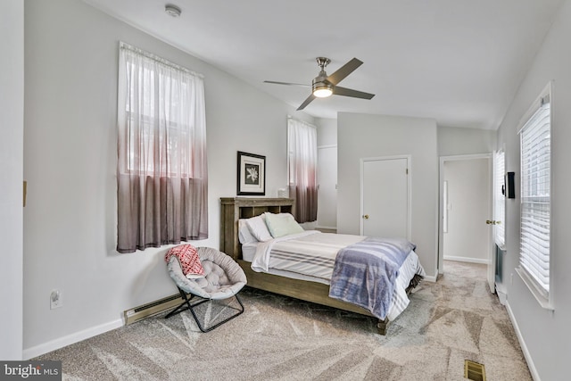 bedroom featuring ceiling fan, lofted ceiling, light carpet, and baseboard heating