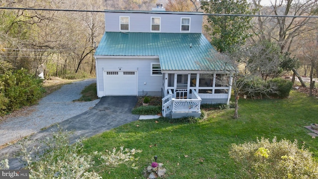 view of front of house with a sunroom and a front lawn