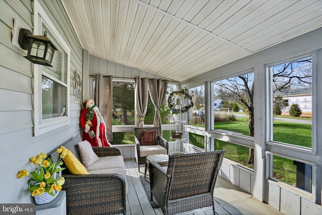 sunroom / solarium with lofted ceiling