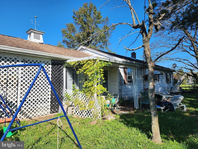 view of home's exterior with a lawn