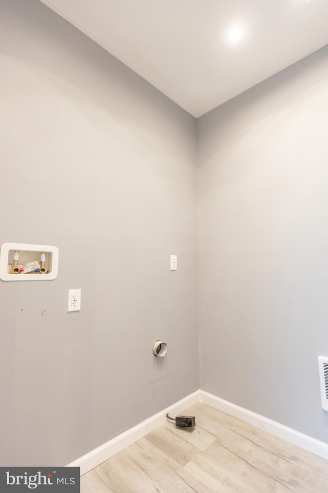 laundry room featuring hardwood / wood-style flooring and hookup for a washing machine