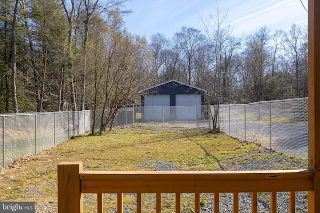 view of yard with a garage and an outdoor structure