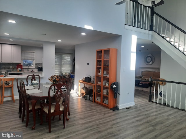 dining room with wood-type flooring and sink