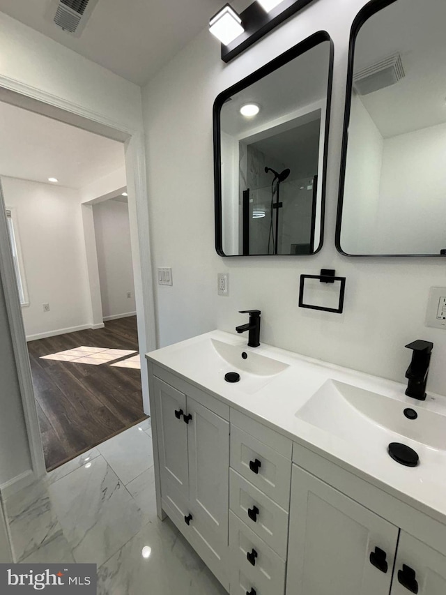 bathroom featuring vanity and wood-type flooring