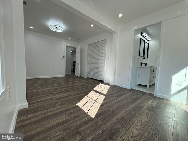 empty room featuring dark hardwood / wood-style flooring