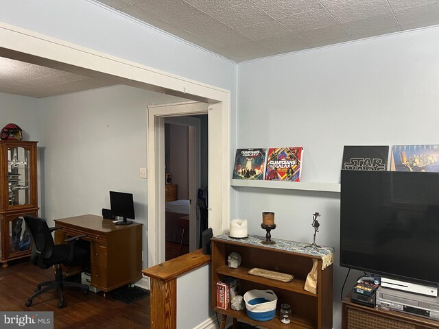 home office with wood finished floors