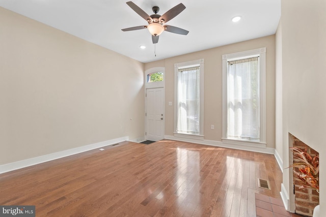 interior space with light wood-type flooring and ceiling fan