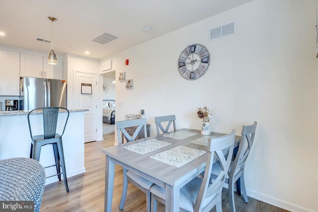 dining room with light hardwood / wood-style floors