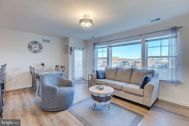 living room with light hardwood / wood-style floors