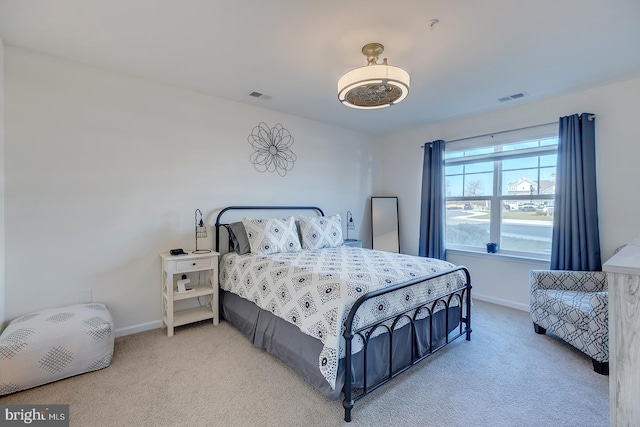 bedroom featuring light carpet