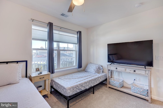 carpeted bedroom with ceiling fan