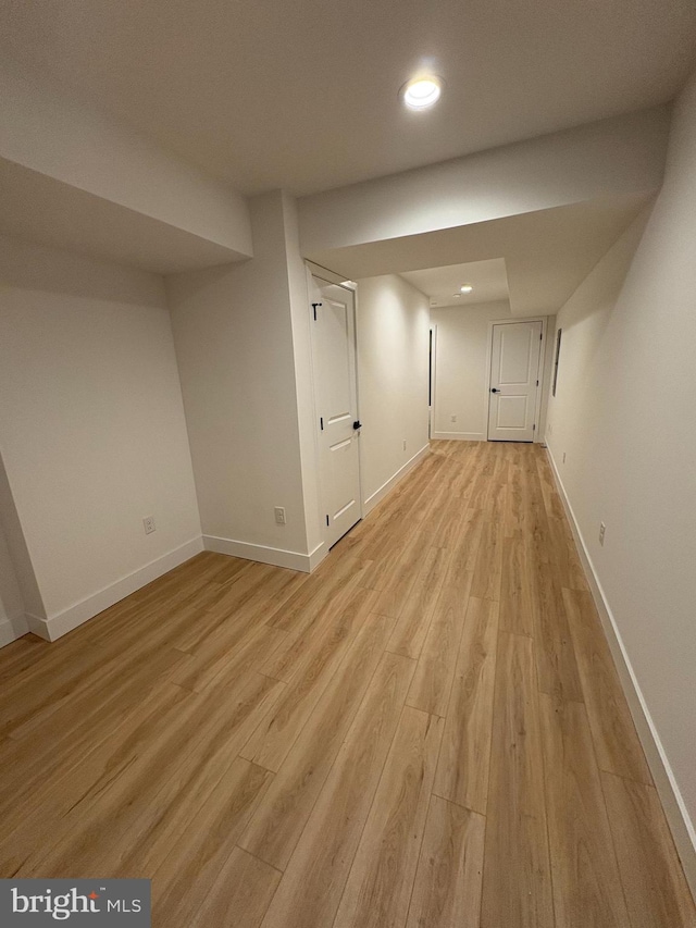 basement featuring light hardwood / wood-style floors