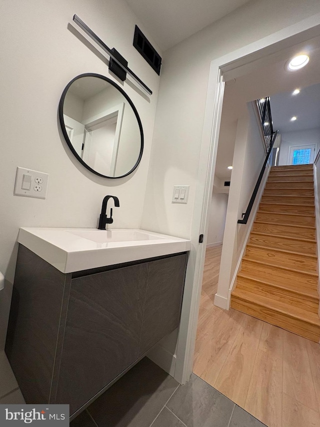 bathroom featuring hardwood / wood-style floors and vanity