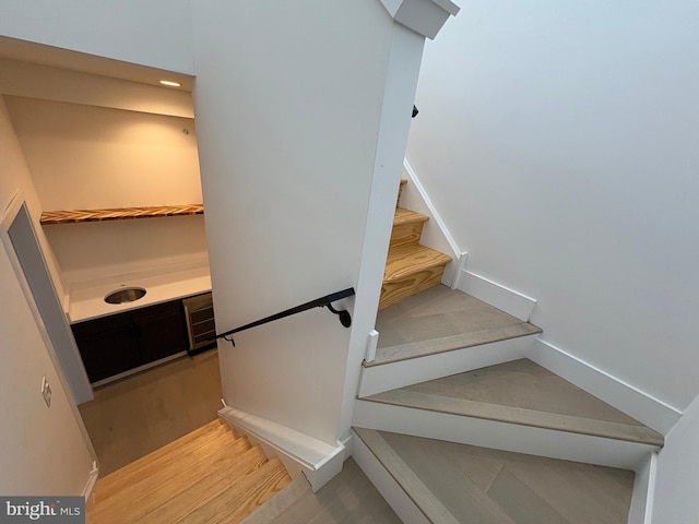 stairs with wood-type flooring