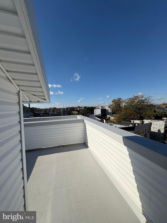 view of patio featuring a balcony