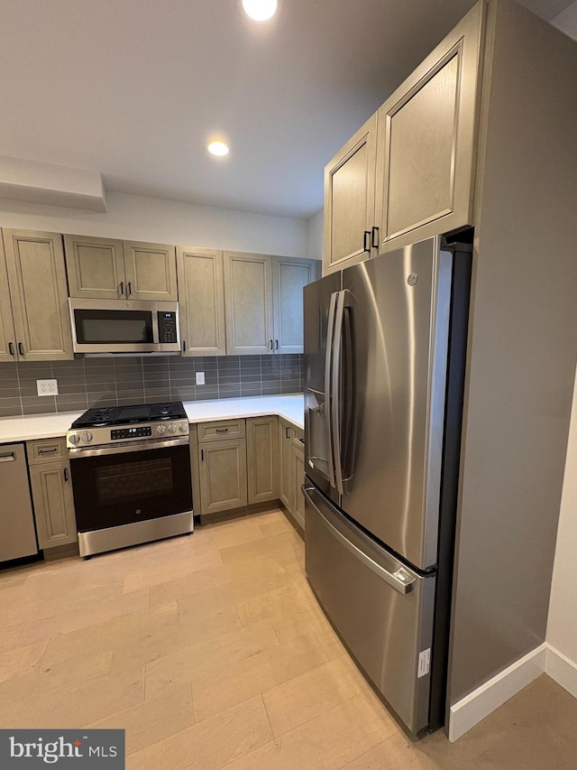 kitchen featuring backsplash and stainless steel appliances