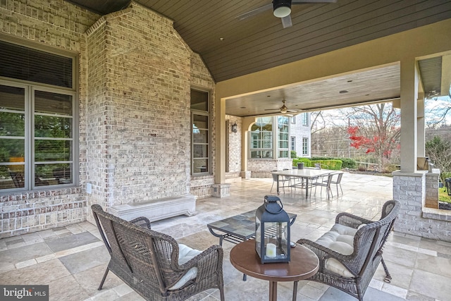 view of patio featuring ceiling fan