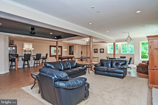 living room featuring crown molding