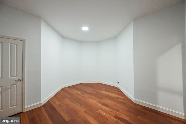 empty room with wood-type flooring