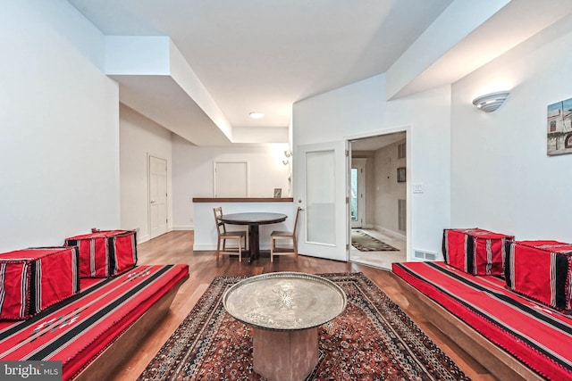 living room with dark hardwood / wood-style flooring