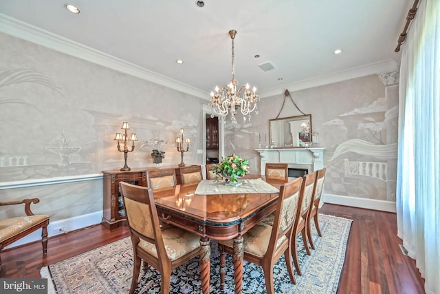 dining area with dark hardwood / wood-style floors, crown molding, and an inviting chandelier