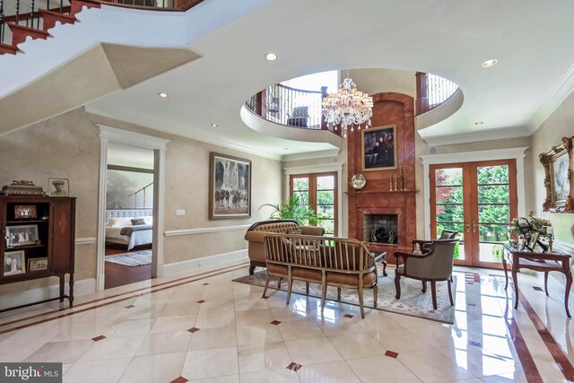 interior space featuring french doors, an inviting chandelier, crown molding, and a healthy amount of sunlight