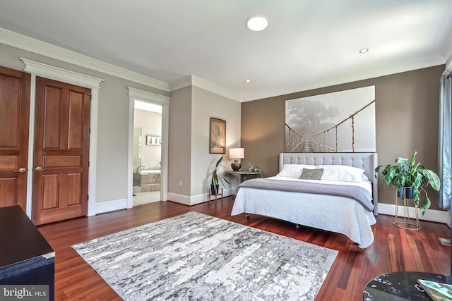 bedroom with ornamental molding, dark wood-type flooring, and connected bathroom