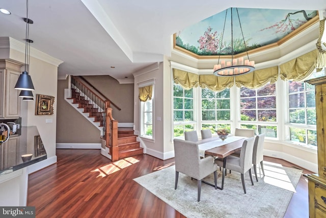 dining space with crown molding, dark wood-type flooring, and an inviting chandelier