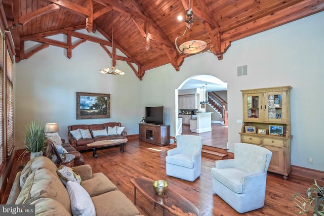 living room with wood-type flooring, high vaulted ceiling, wood ceiling, and beam ceiling