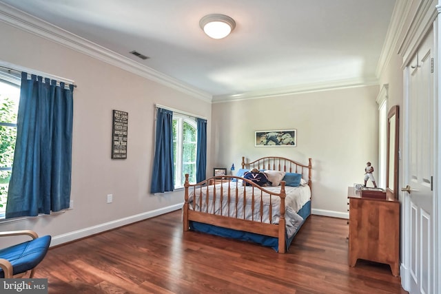 bedroom featuring dark hardwood / wood-style flooring and crown molding