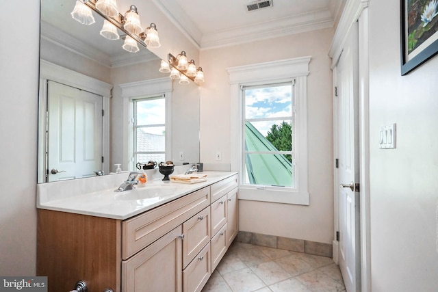 bathroom featuring tile patterned flooring, vanity, plenty of natural light, and crown molding