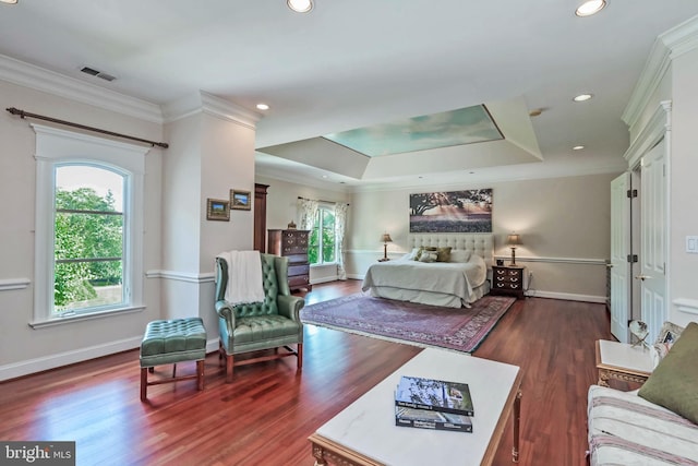 bedroom featuring dark hardwood / wood-style floors, a raised ceiling, multiple windows, and crown molding