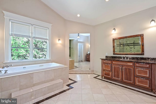 bathroom featuring tile patterned floors, vanity, vaulted ceiling, and independent shower and bath