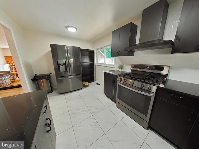 kitchen featuring stainless steel appliances, wall chimney range hood, and backsplash