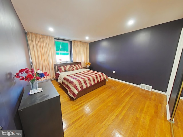 bedroom featuring hardwood / wood-style flooring