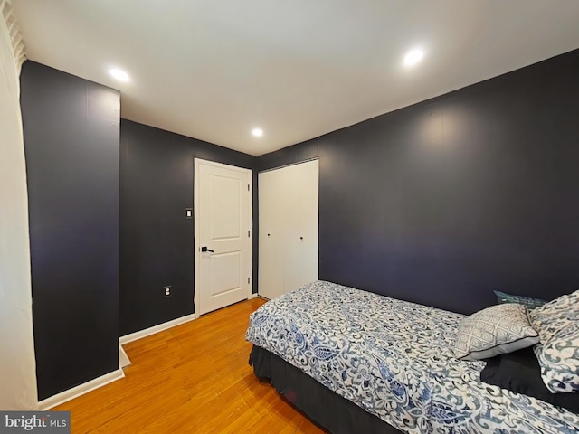 bedroom with hardwood / wood-style flooring