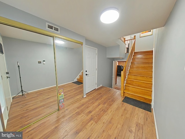 basement featuring light hardwood / wood-style floors