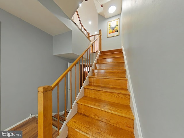 stairway featuring hardwood / wood-style floors