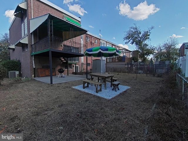 exterior space with cooling unit and a patio area