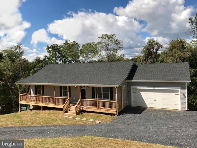 view of front of house featuring a garage and covered porch