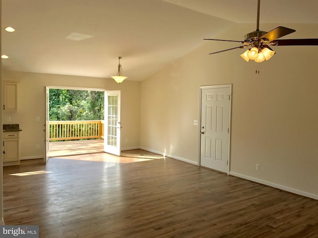 unfurnished living room featuring hardwood / wood-style floors, ceiling fan, and high vaulted ceiling