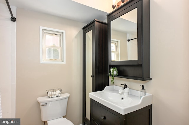 2142 Lake Dr, Pasadena, MD 21122 - bathroom with toilet and vanity