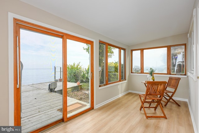2142 Lake Dr, Pasadena, MD 21122 - sunroom / solarium featuring wood finished floors, baseboards, a water view, and vaulted ceiling