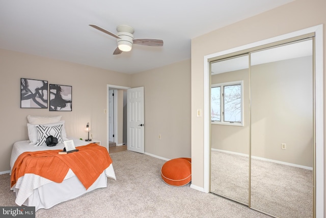 2142 Lake Dr, Pasadena, MD 21122 - carpeted bedroom with a closet, baseboards, and ceiling fan