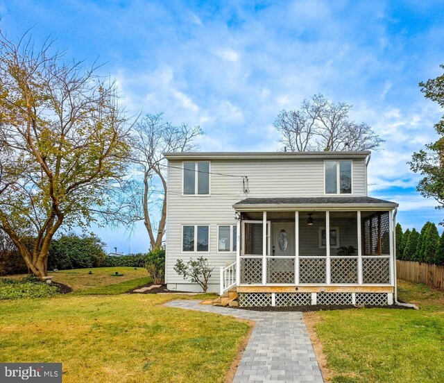 2142 Lake Dr, Pasadena, MD 21122 - traditional-style home featuring a sunroom