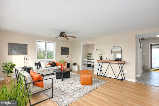 2142 Lake Dr, Pasadena, MD 21122 - living room with wood finished floors, plenty of natural light, a ceiling fan, and baseboards