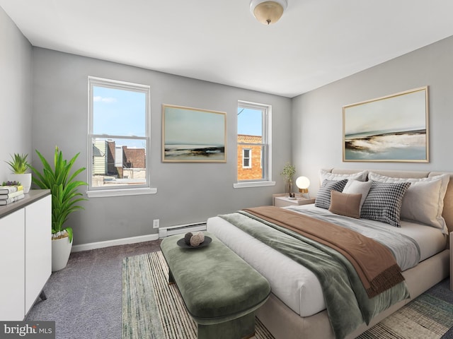 bedroom with baseboard heating, carpet, and multiple windows