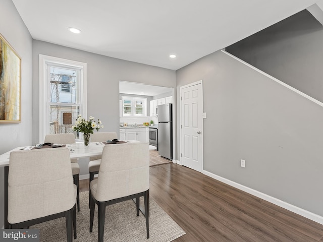 dining space featuring dark hardwood / wood-style flooring